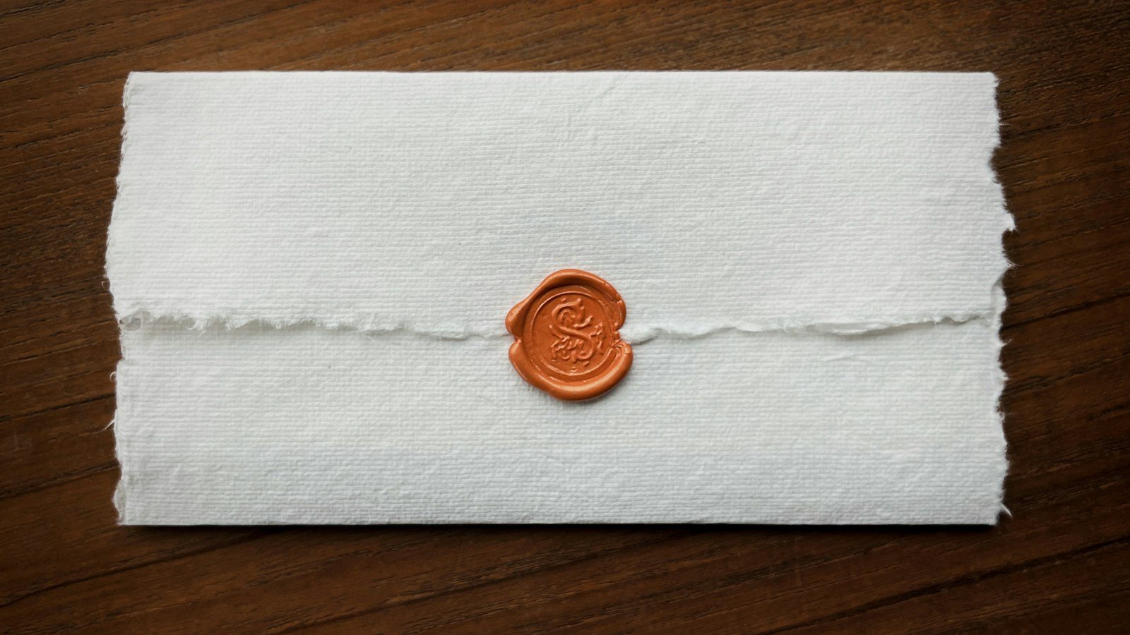 Envelope closed with an orange wax seal